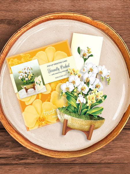 Lifestyle view of greeting card, envelope and notecard on plate