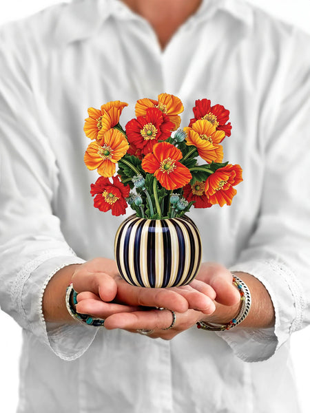 Model holds Mini French Poppies greeting card