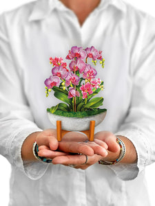 Model holds Mini Orchid greeting card