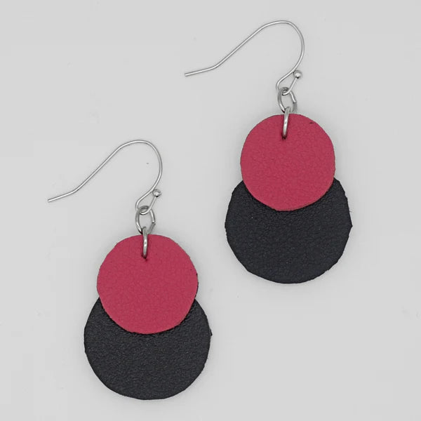 Close up view of pink and black Paris dangle earrings