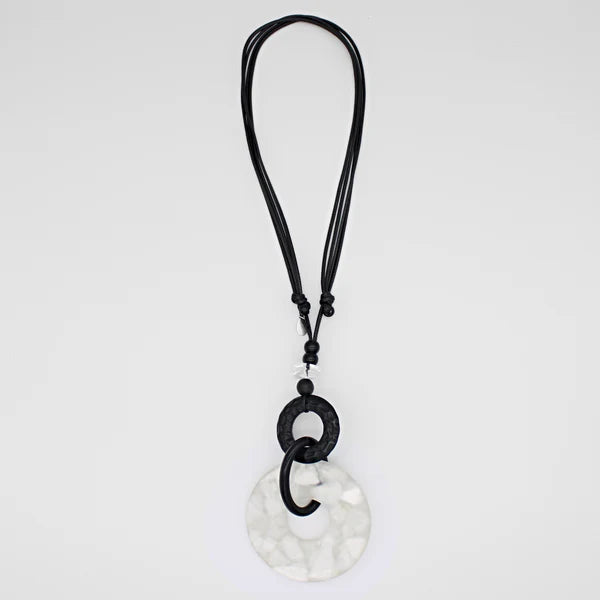 Close view of Riviera white and black pendant