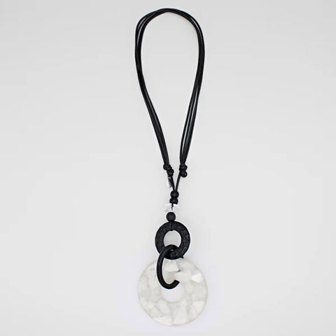 Close view of Riviera white and black pendant