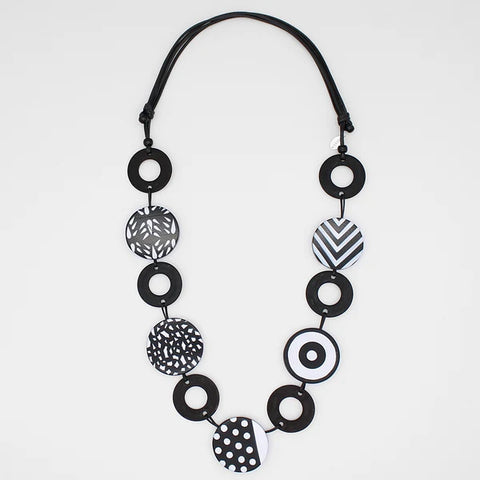 Close view of Celine Circles black and white statement necklace