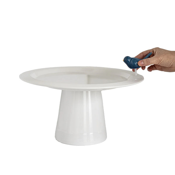 Round platter on top of Melamine high riser