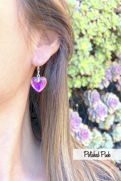 model wears pink heart earrings