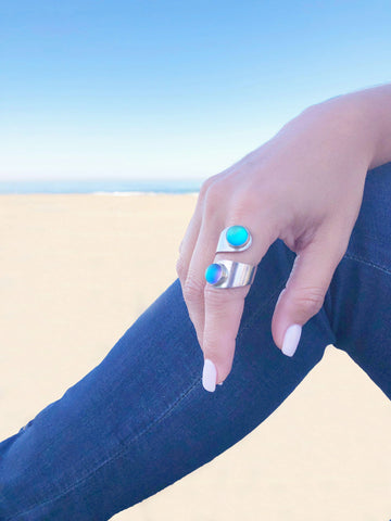 Double circle blue crystal ring shown on hand of model - Leightworks jewelry