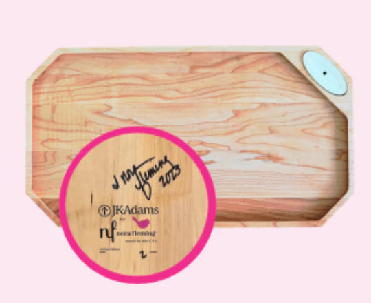 Signed maple board by Nora Fleming