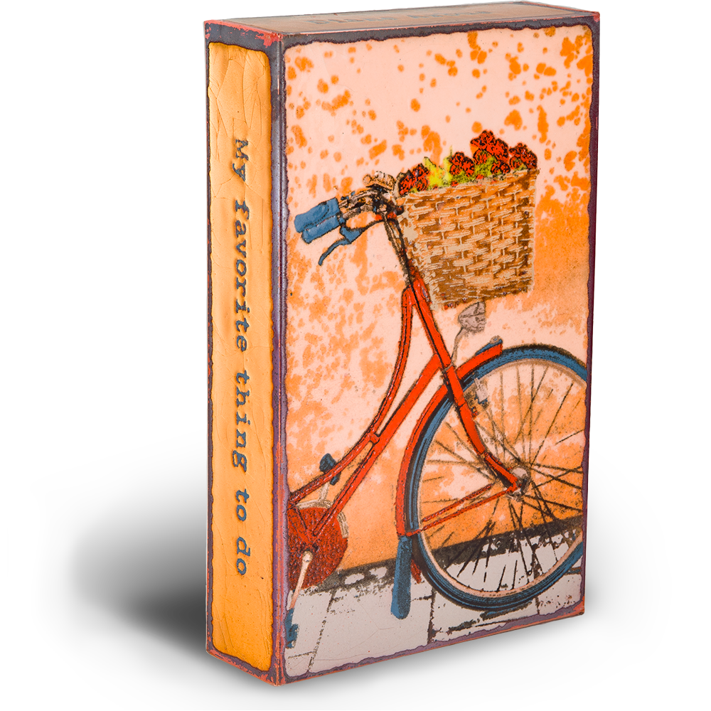 Fresh Ride Spiritile by Houston Llew - "My favorite thing to do is to go where I've never been." - Diane Arbus - Image shows front part of red bicycle with a basket of flowers on the handlebars