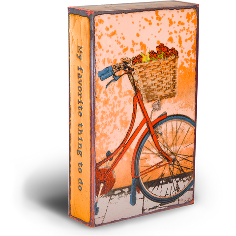 Fresh Ride Spiritile by Houston Llew - "My favorite thing to do is to go where I've never been." - Diane Arbus - Image shows front part of red bicycle with a basket of flowers on the handlebars