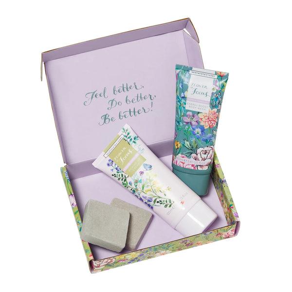 Flower of Focus Power Through pick-me-up set in box, showing body wash, cream and shower pellets