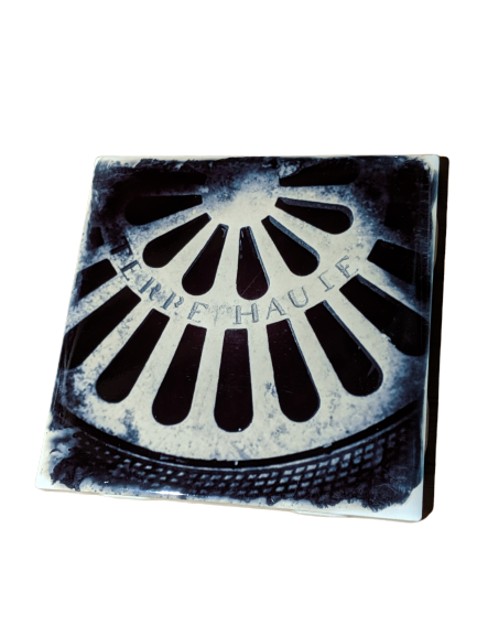 Terre Haute Manhole cover depicted on a ceramic coaster made by Cityscape Tiles