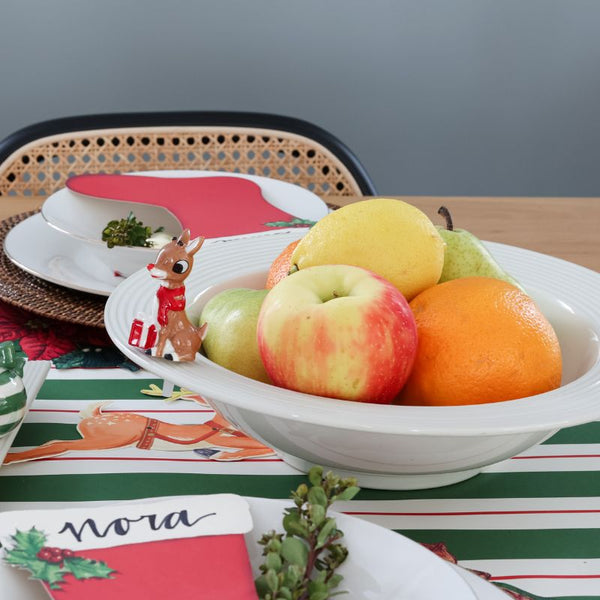 New pinstripes baby bowl by Nora Fleming filled with fruit and decorated with Rudolph mini