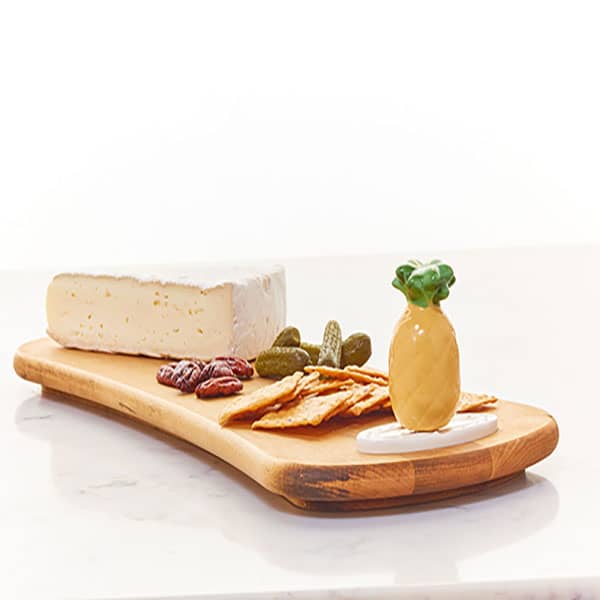 Welcome Friends! - Nora Fleming pineapple mini, shown on wooden cheese board